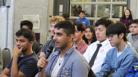 Student asks question during fireside chat