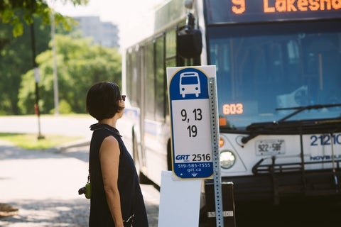 Woman is about to board the bus