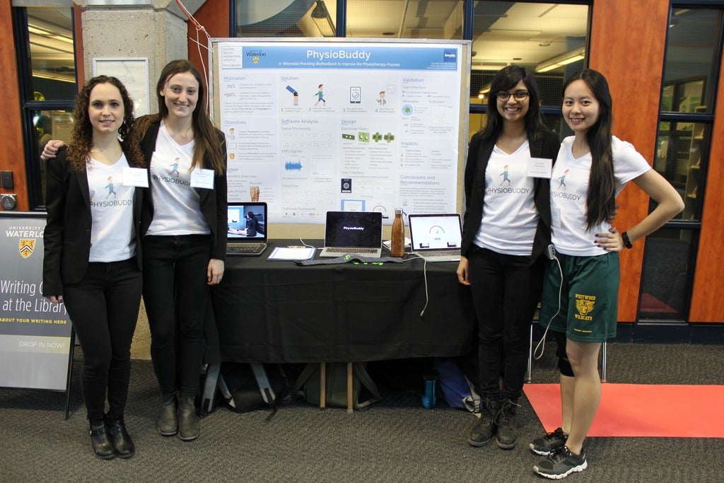 Student team standing beside project table