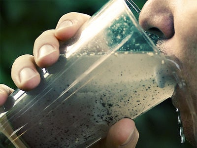 Person drinking dirty water