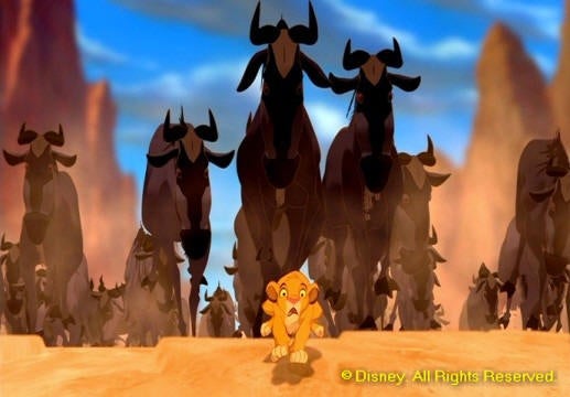 screen shot from the disney film lion king Simba running away from wildebeests 
