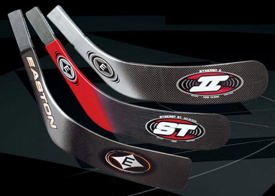 three diferent hockey sticks on black background