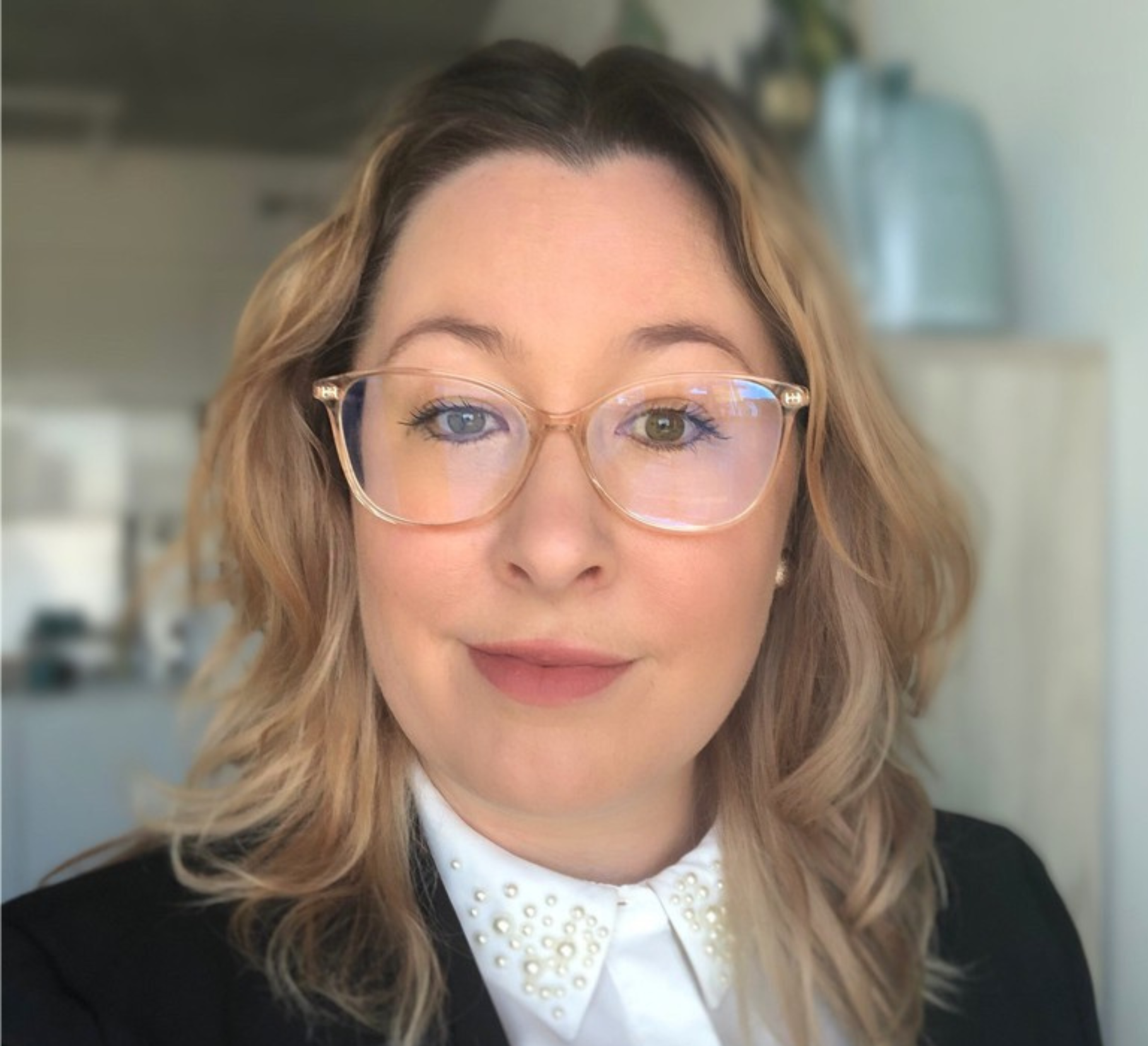 A professional headshot of Eily Hickson