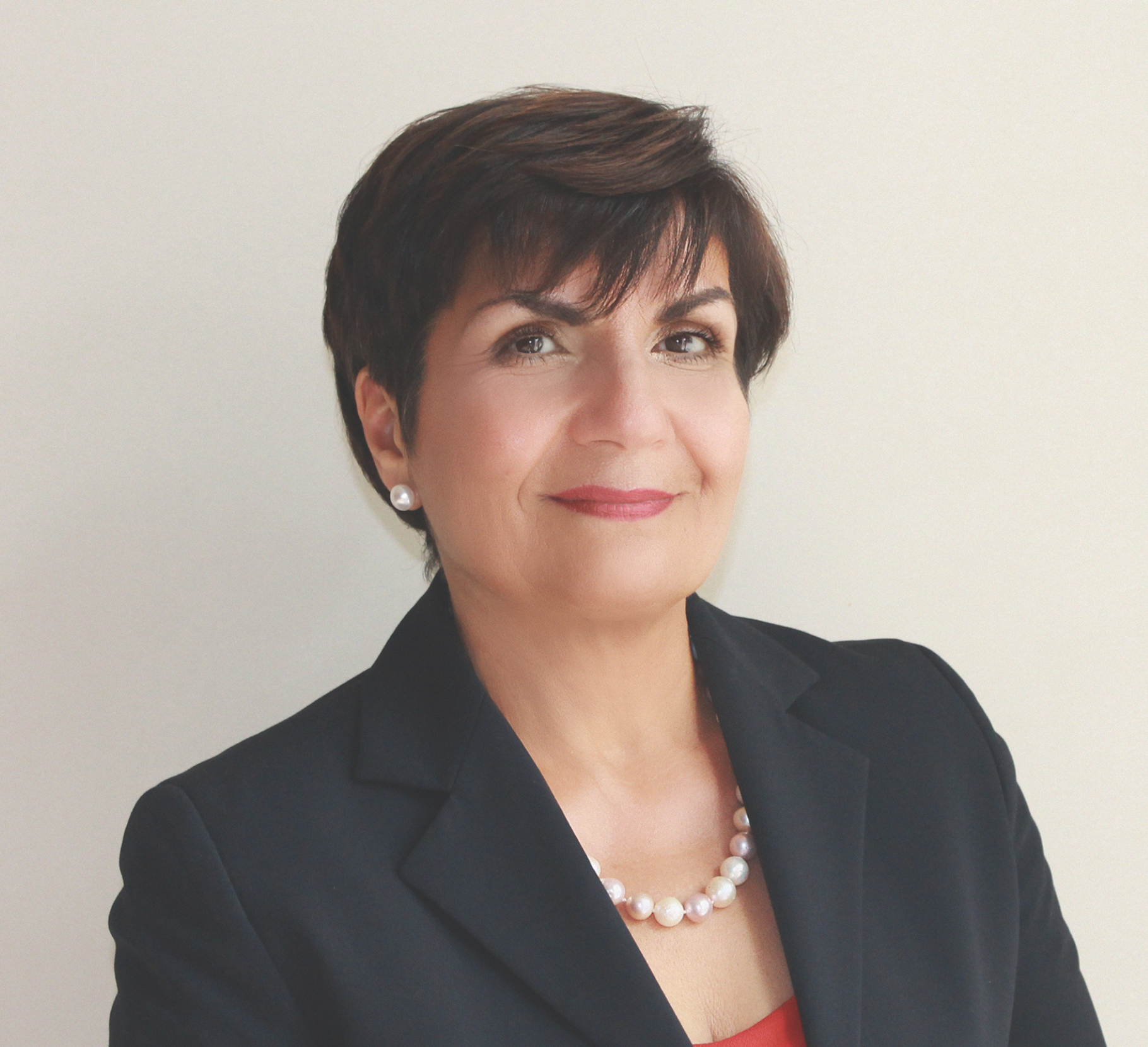 A professional headshot of Gina Cody