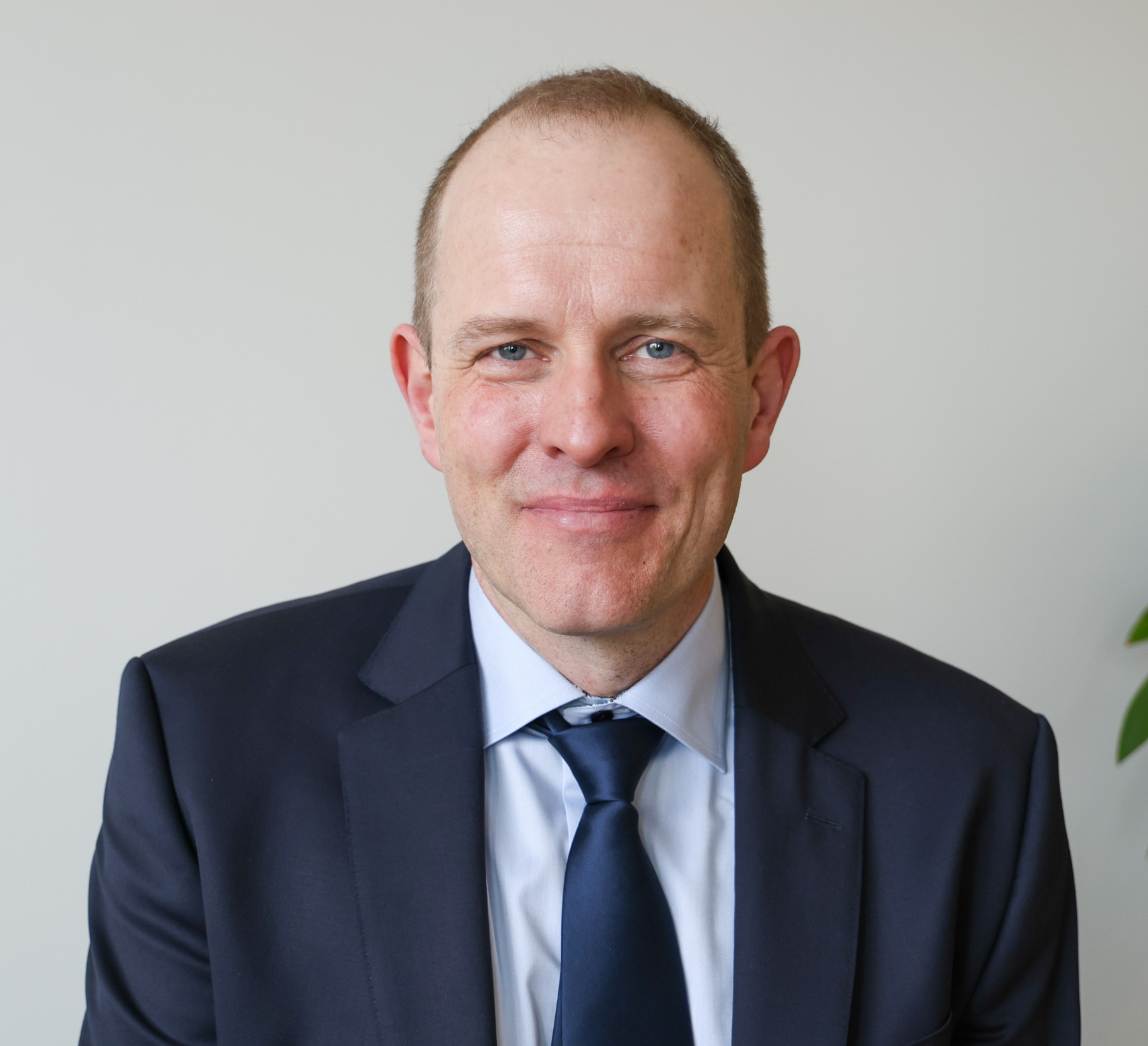 A professional headshot of Jochen Koenemann