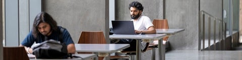 Student studying with laptop in the Quantum Nano Centre