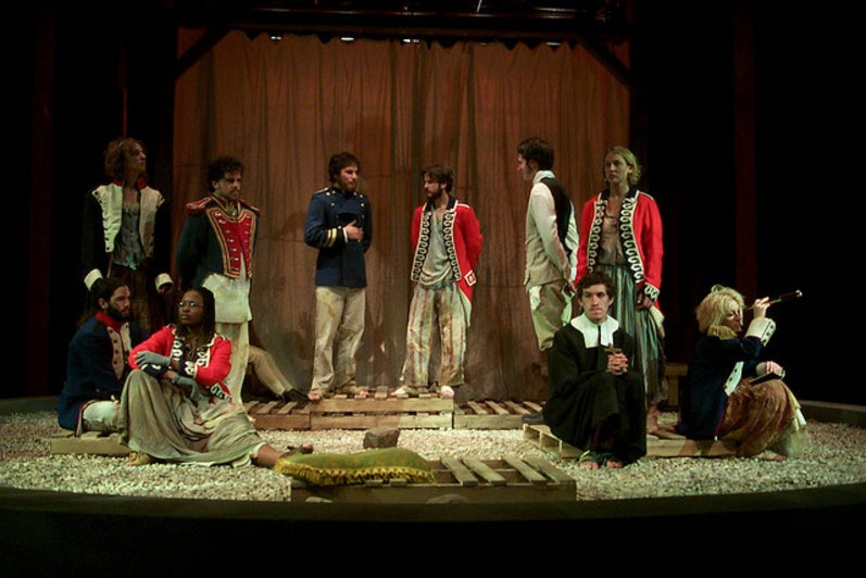 Group of people on stage in the play 'Our Country's Good'