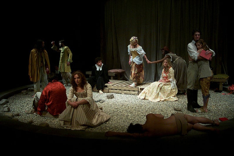 Group of people on stage in the play 'Our Country's Good'