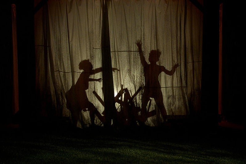 Shadows of people in the play 'Our Country's Good'