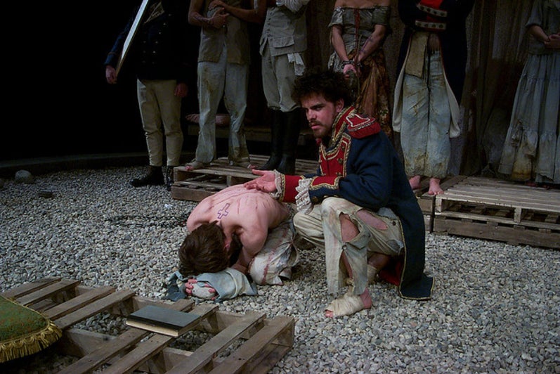 Man kneeling over a woman on her knees