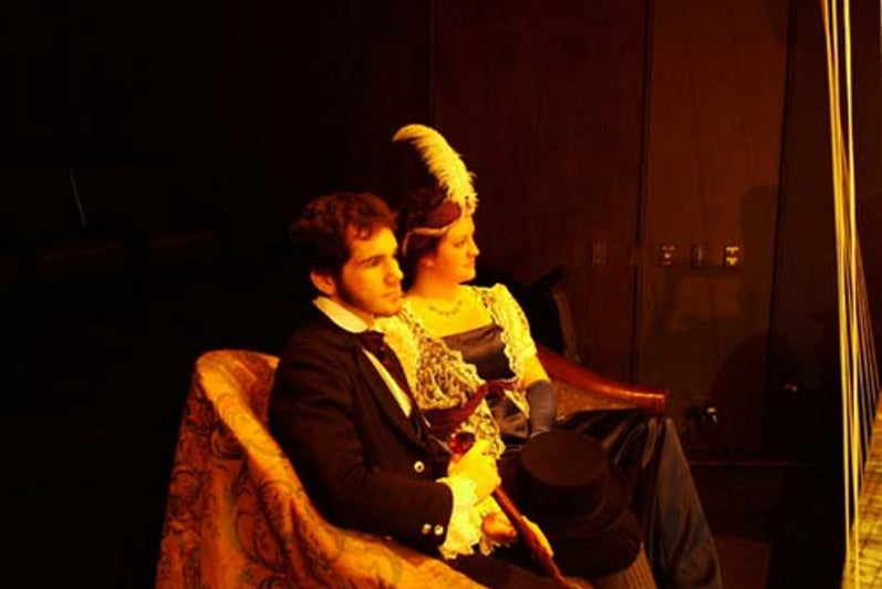 Man and woman sitting together in costume