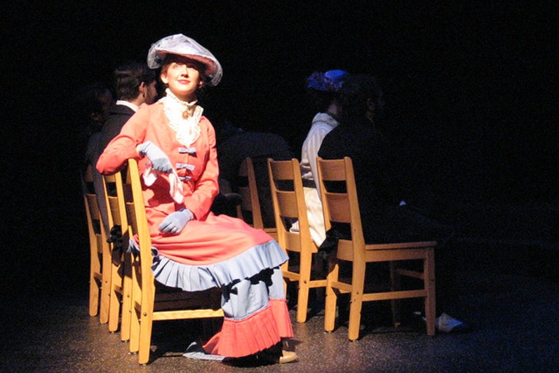 Woman sitting on stage