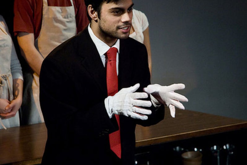 Man wearing gloves and speaking