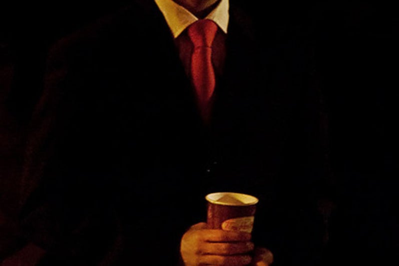 Man standing with a coffee cup