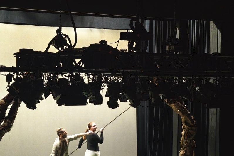 Props Coordinator Shaw Forgeron and Assistant Technical Director / Production Manager Emma Raynard use a long stick to set up the petal drop.