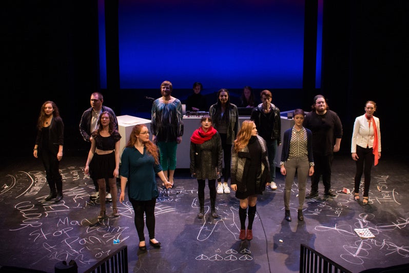 Full Cast standing on stage