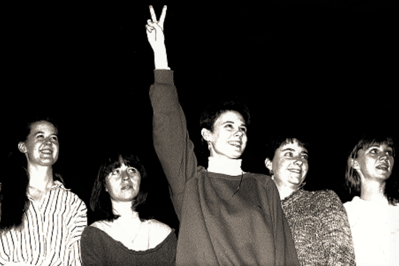 Cast together with peace hand sign in the air