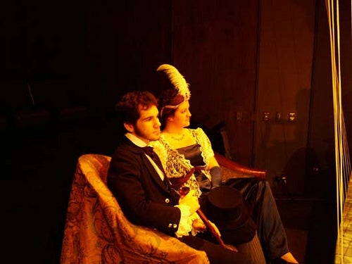 Man and woman sitting together in costume