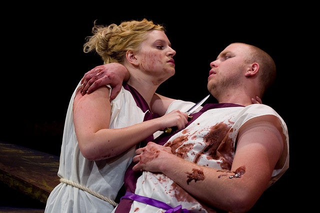 Woman stabbing a man in the play 'Julius Caesar'