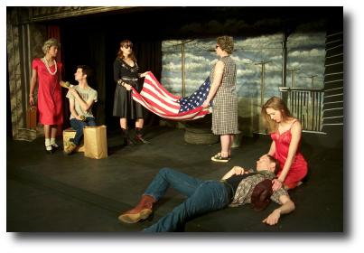 Cast of Totally Durang-ed performing on stage with one man acting dead on the ground