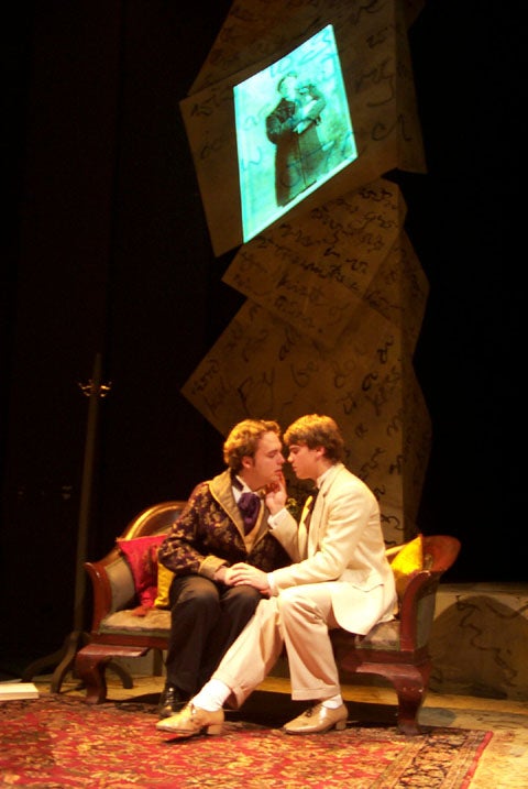 Two people about to kiss on a couch