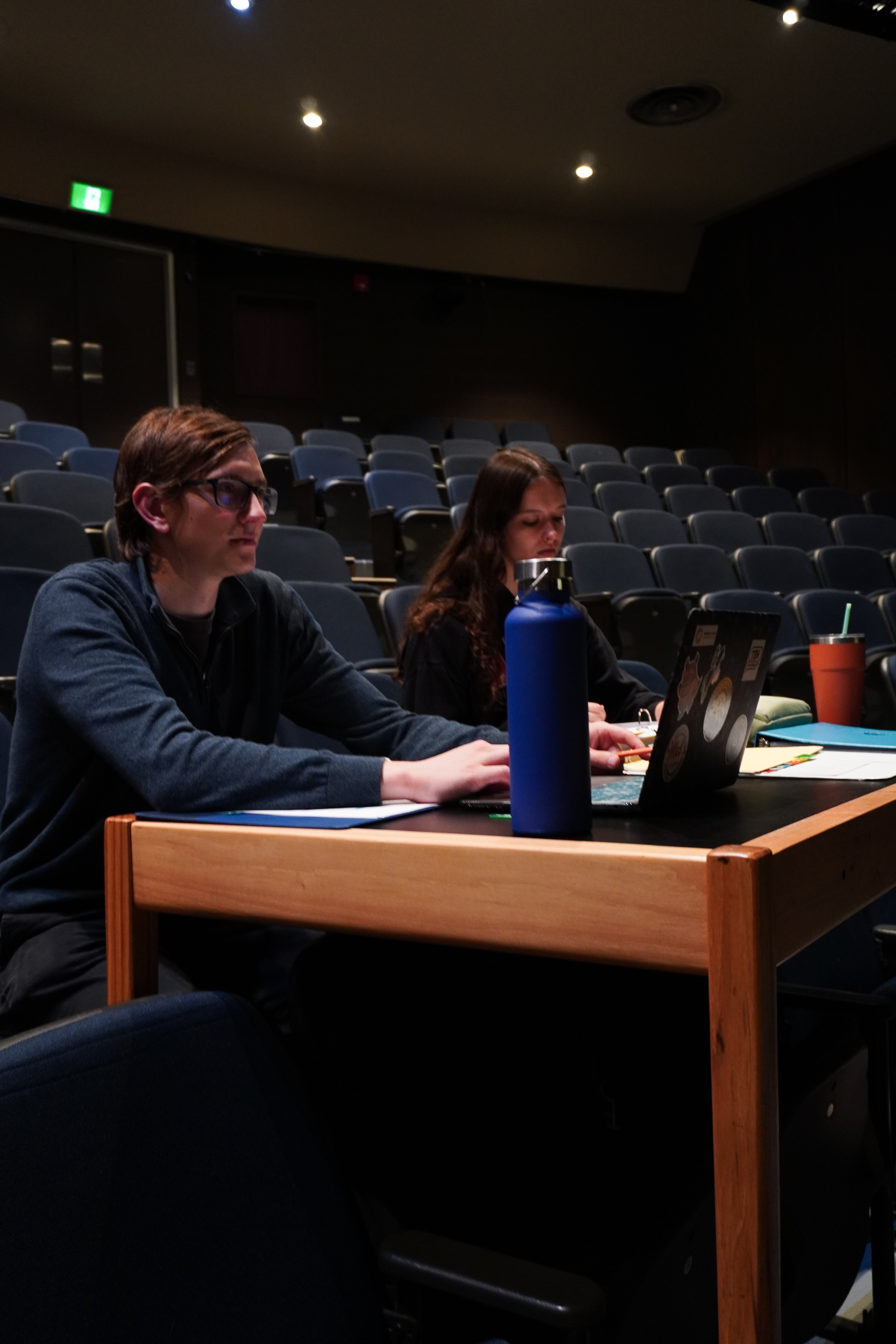 Assistant Stage Manager of Wardrobe Olivia Rossel and Assistant Stage Manager of Props Christopher DeLenardo oversee a rehearsal.
