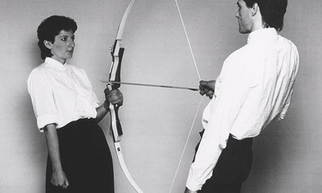 two people holding a bow and arrow