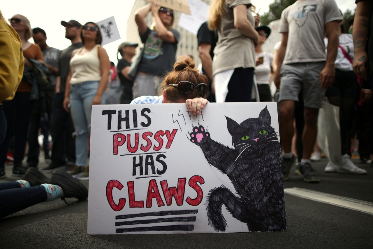 Protester holding up sign