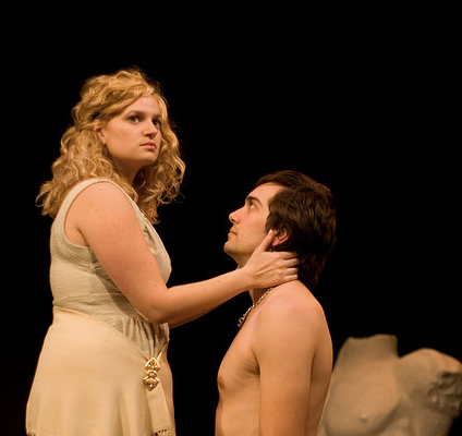 Man kneeling in front of woman in the play 'Julius Caesar'