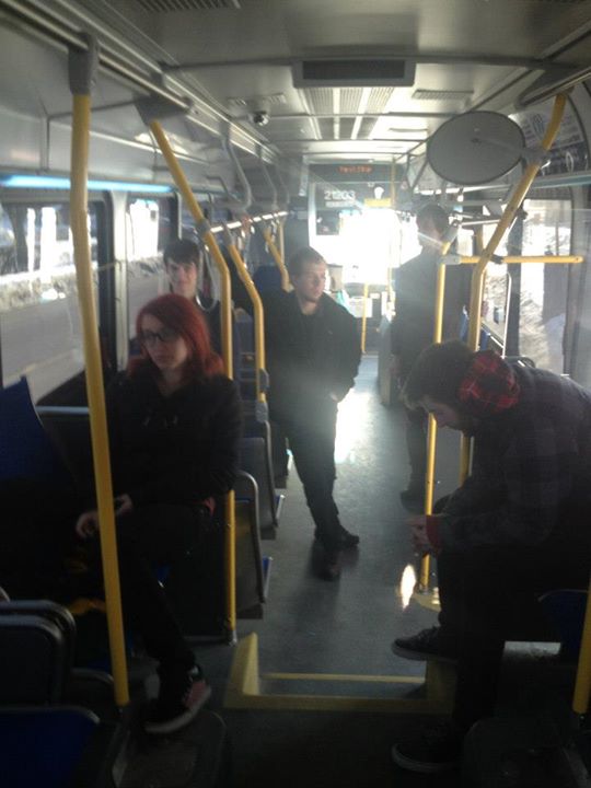 Actors stand on bus
