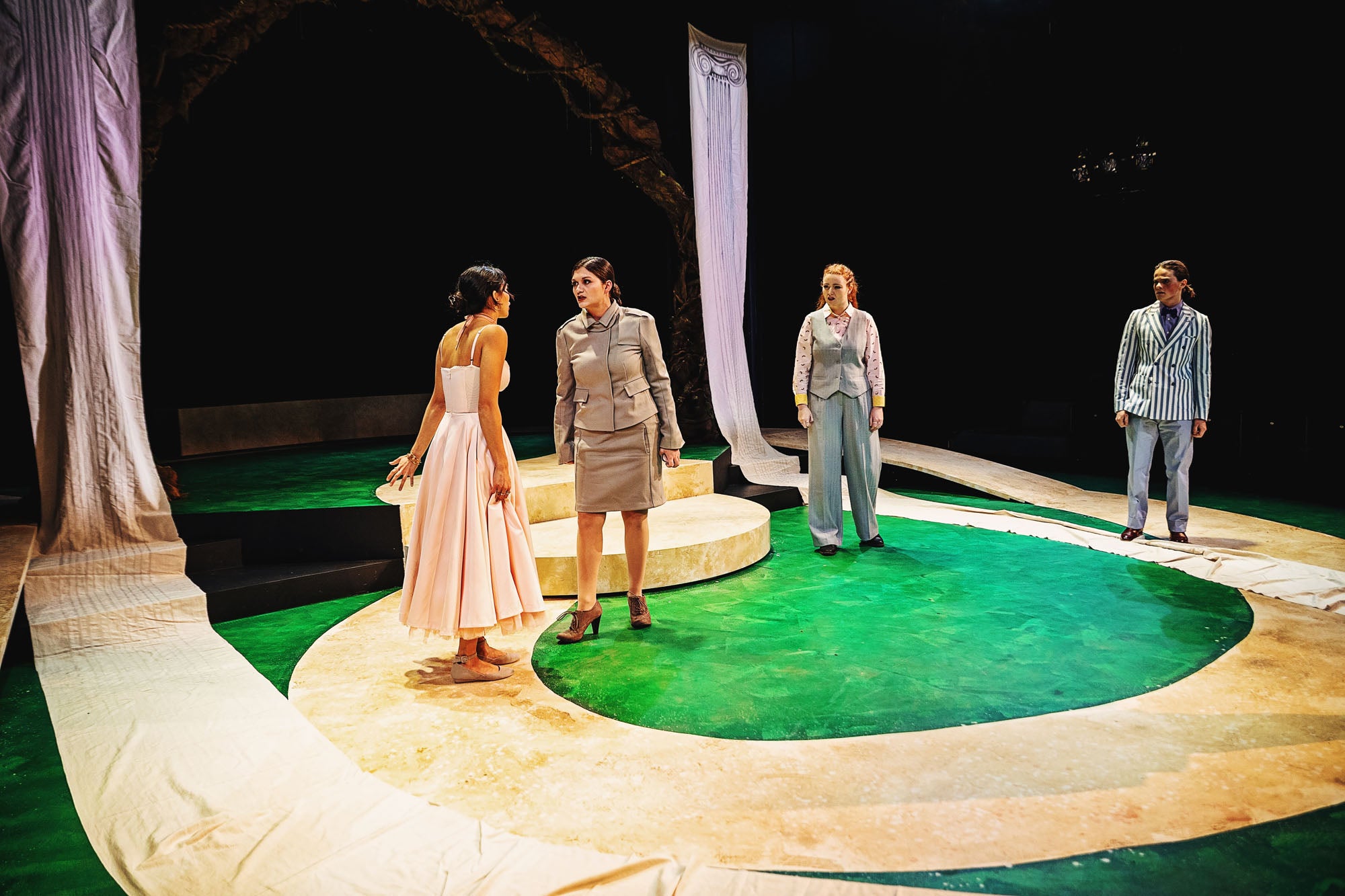 Egeia (Isabella Renzella) berates her daughter Hermia (Rivanna Laslavic) for the latter's failure to obey her mother's wishes, while the Athenian Nobles (Lysandra and Demetrius, not pictured: Theseus and Hippolyta) look on.