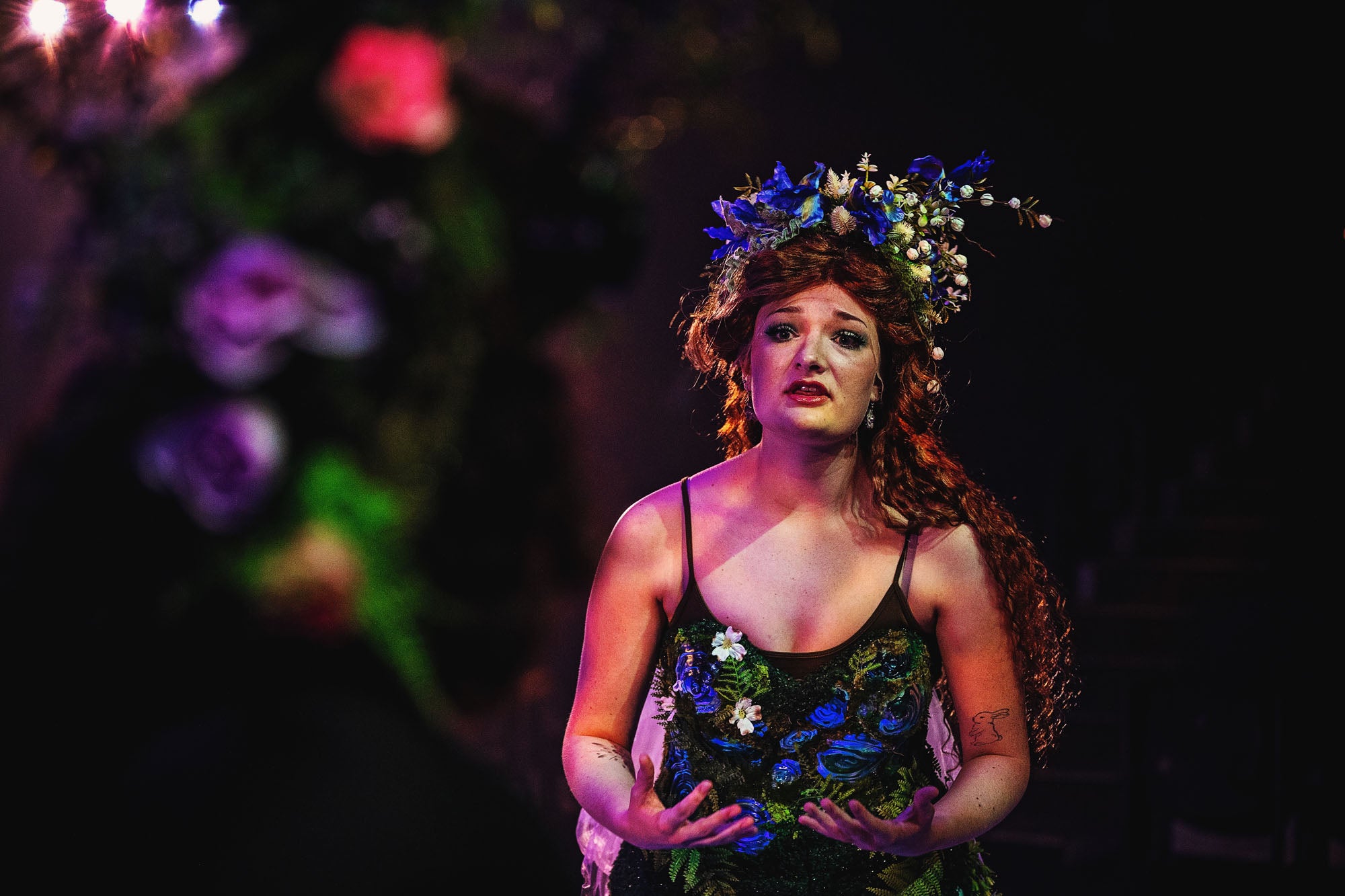 Titania (Morgaine McEvoy) passionately confesses her bewitched love to a bewildered Nick Bottom (Theo Patterson).