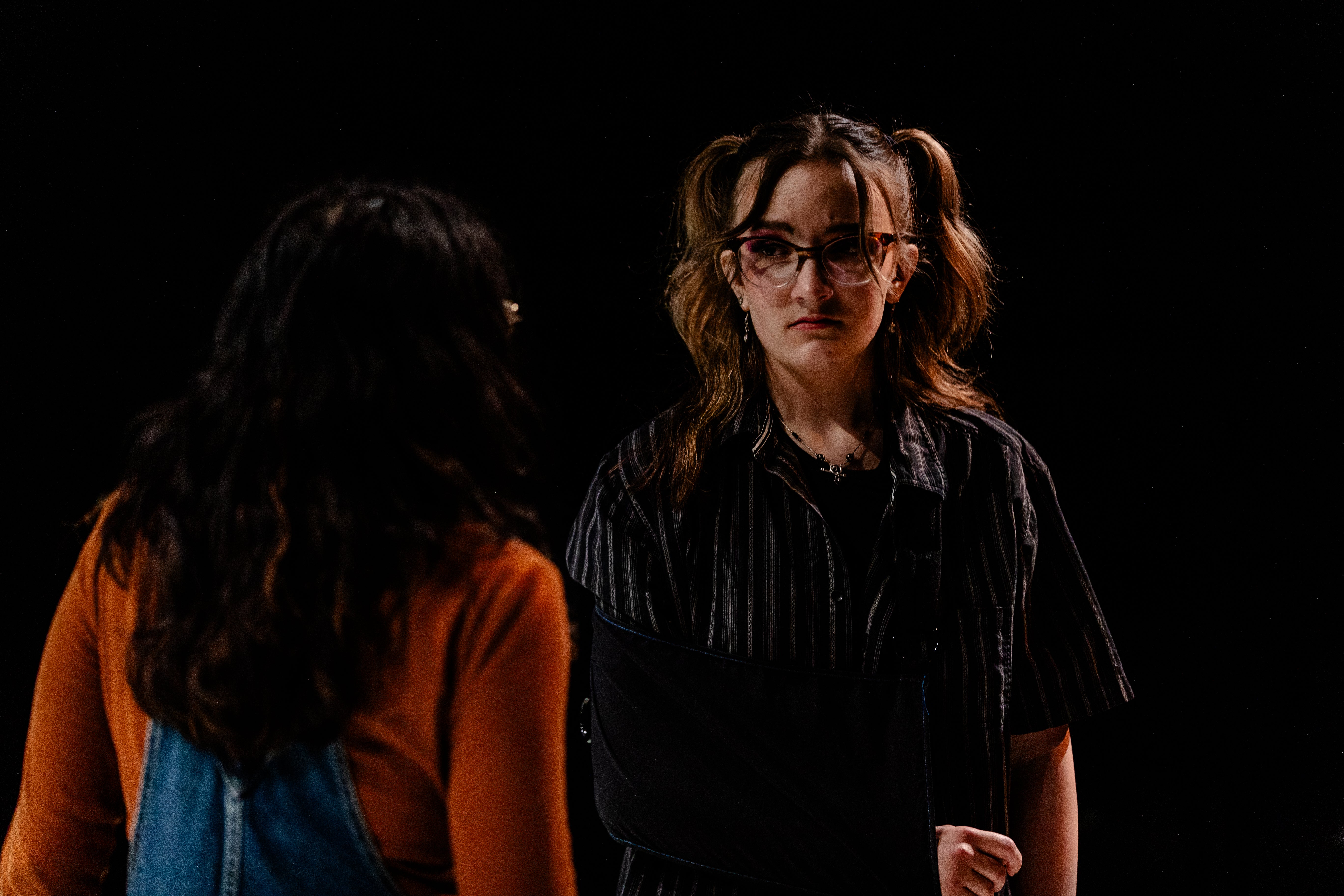 Characters Olivia and Mia conversing