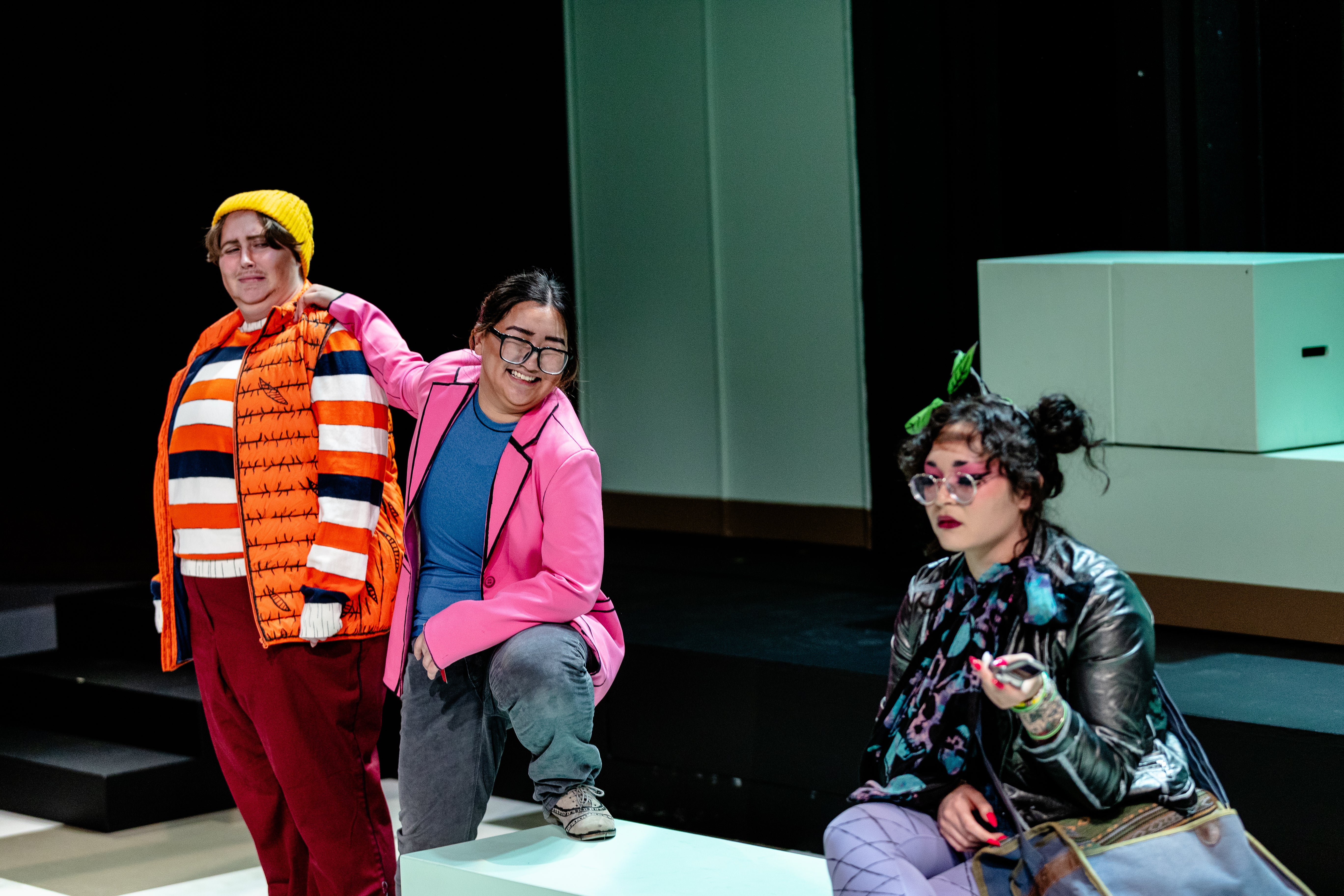 Aamir grabbing Dylan's shoulder and smiling at Tee