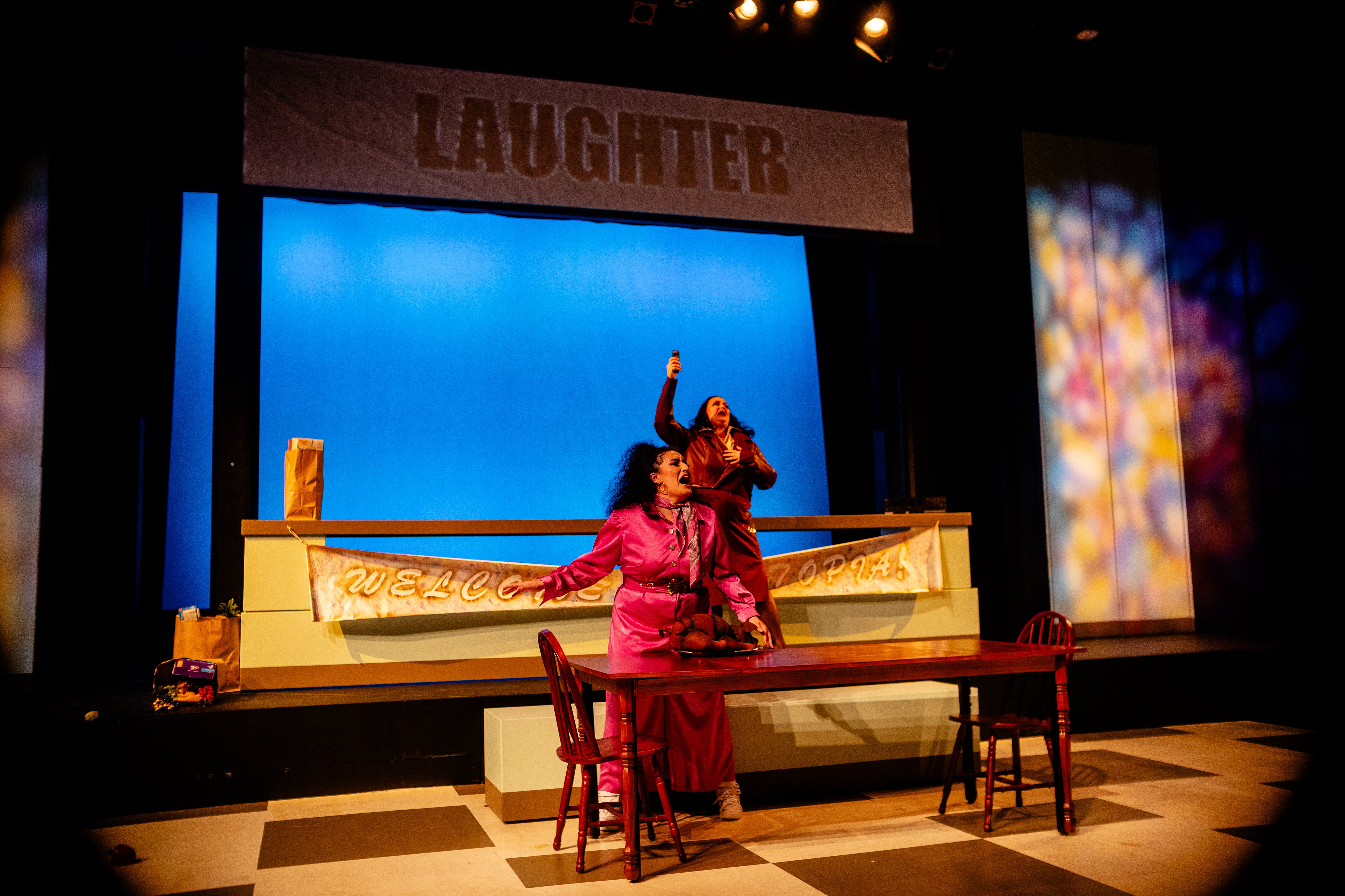 Beaty and Charlotte excitedly encouraging audience to laugh