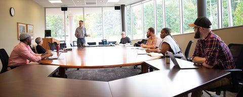 Students attentively listening to professor in class