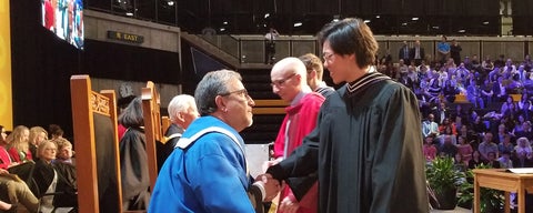 MTS grad shaking hands with President of UWaterloo at Convocation