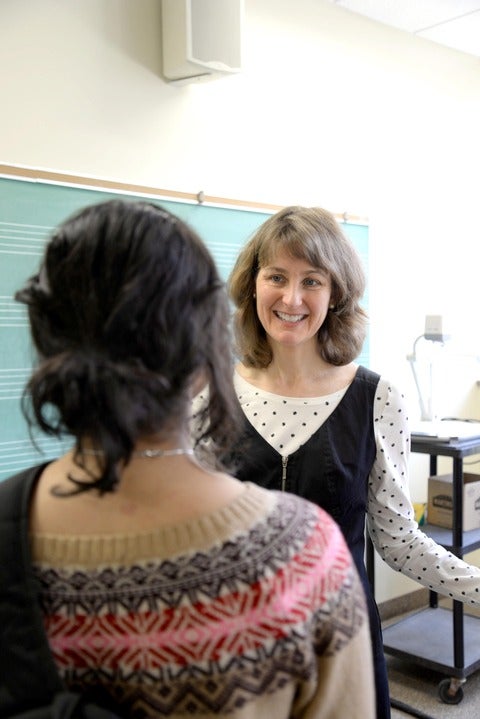 Alicia Batten talks with a student.