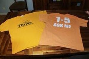 Thrive t-shirt and an old Thrive t-shirt with &quot;1 in 5 ask me&quot;