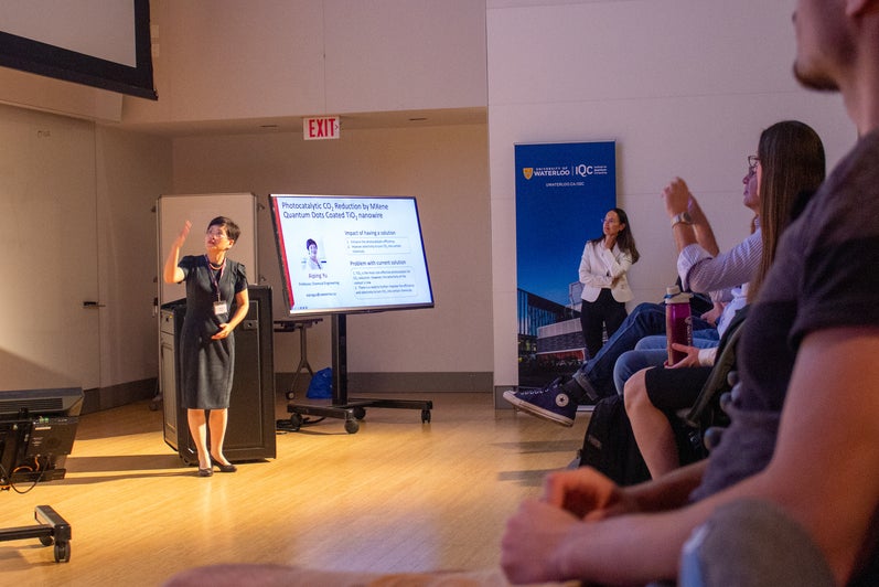 Speaker at the front of a room. 
