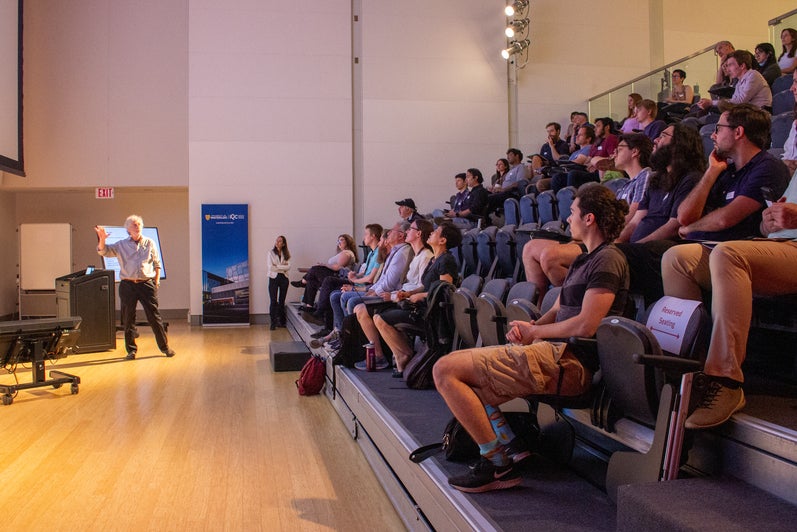 Speaker at the front of a room. 