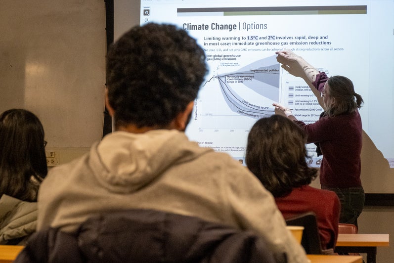 A person giving a presentation to a room full of people. 