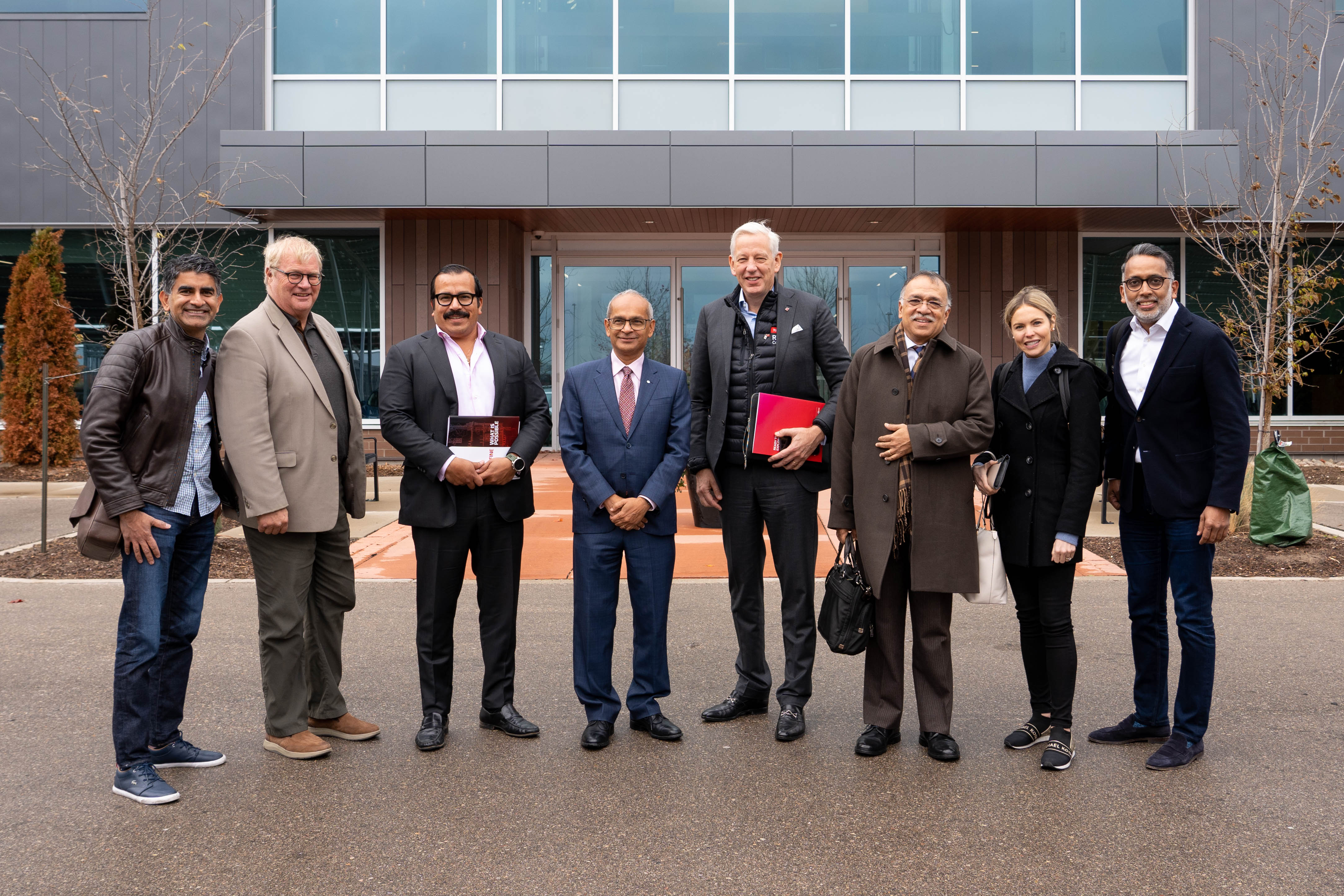 A group of people standing in front of a building. 