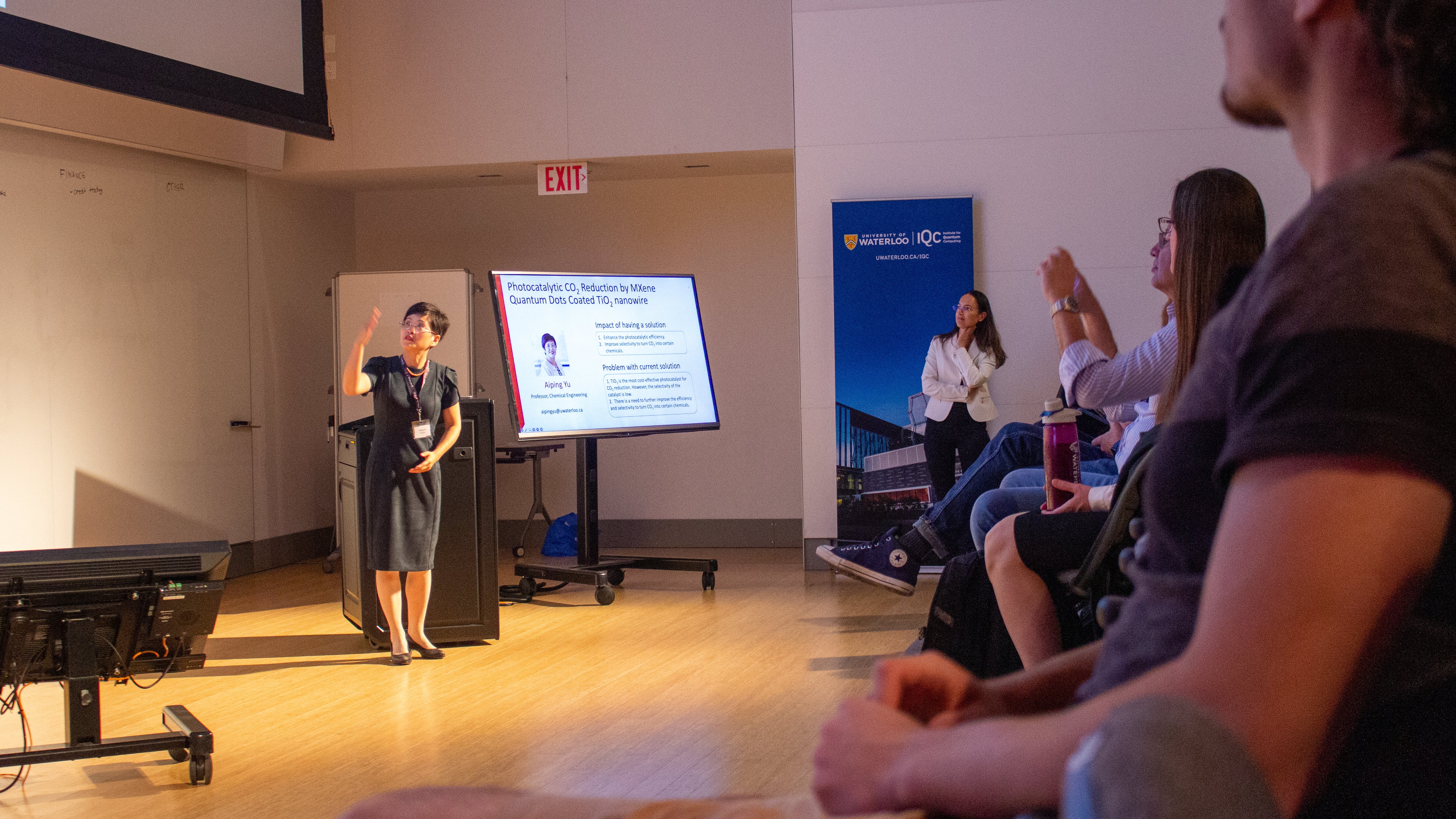 Speaker at the front of a room. 