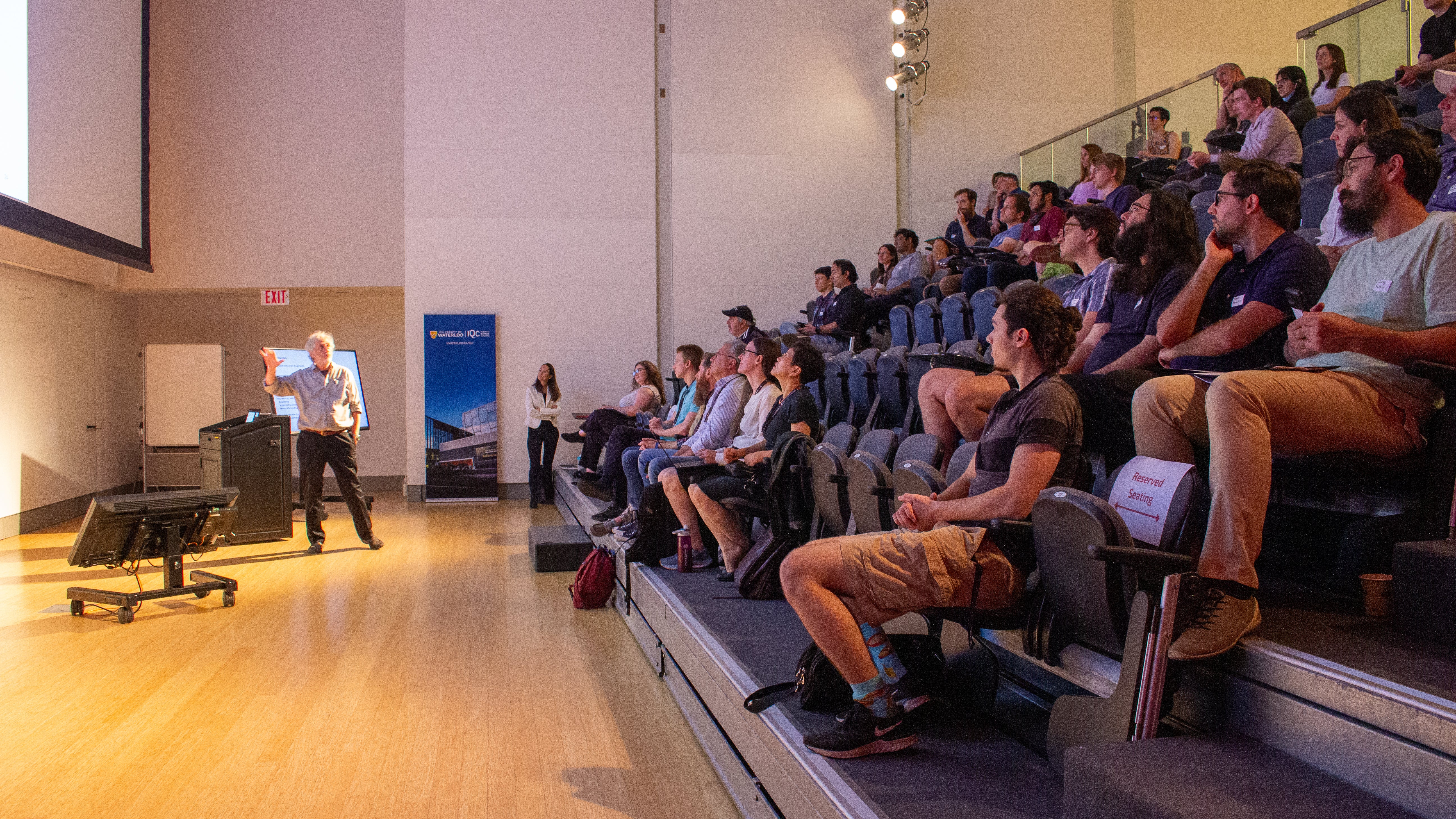 Speaker at the front of a room. 