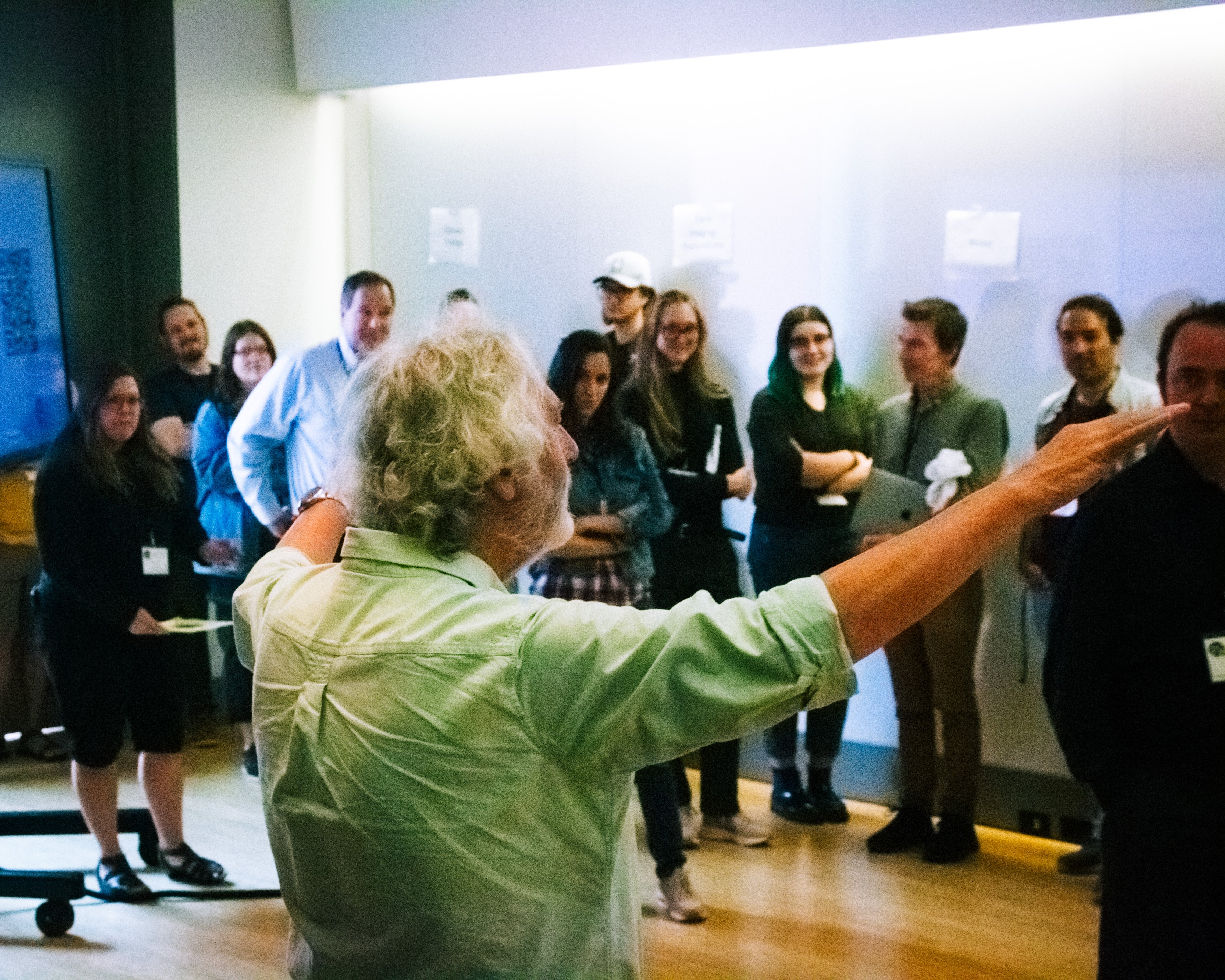 A person talking to a group of people. 