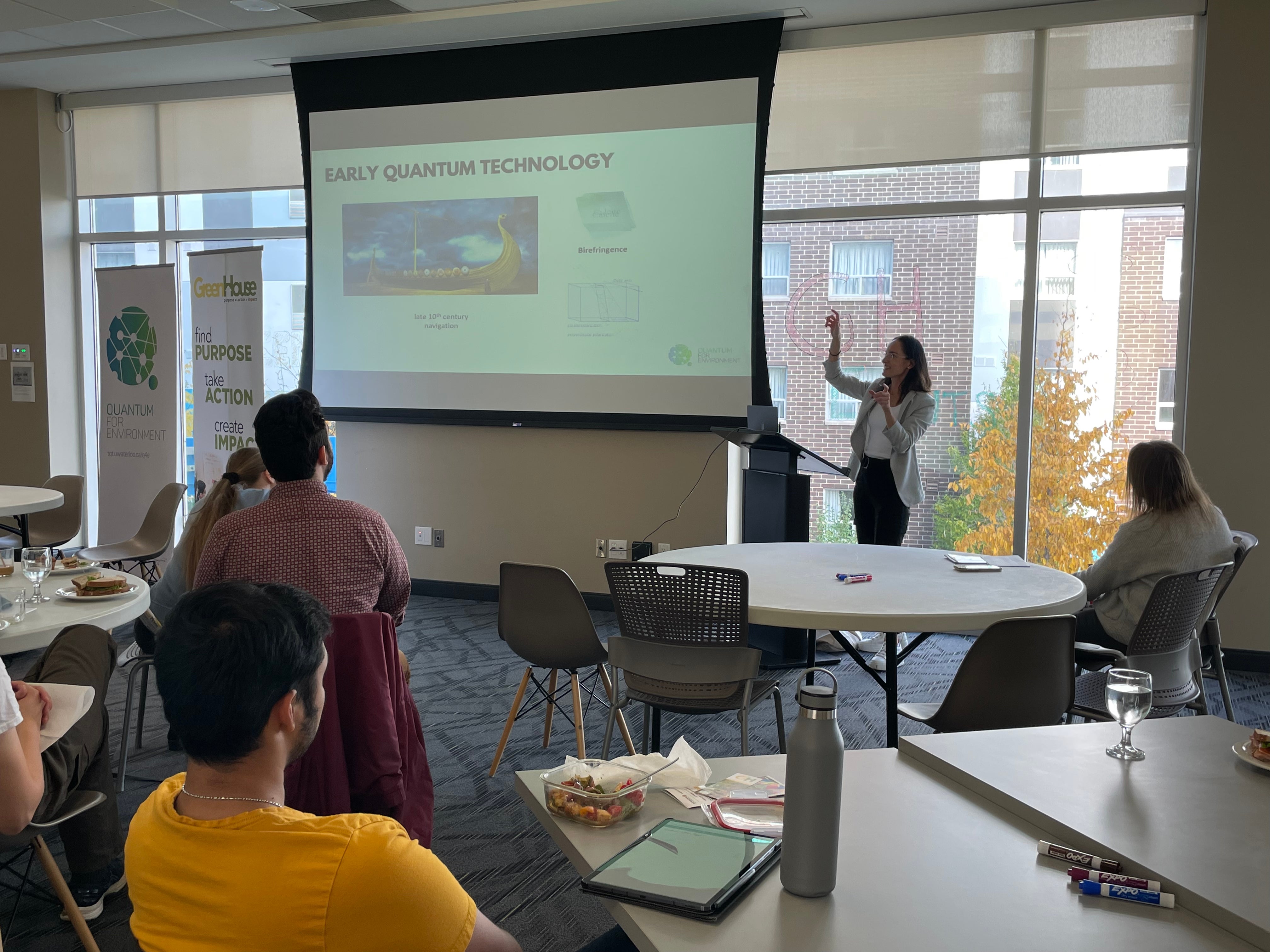 A person giving a presentation to a room of people. 