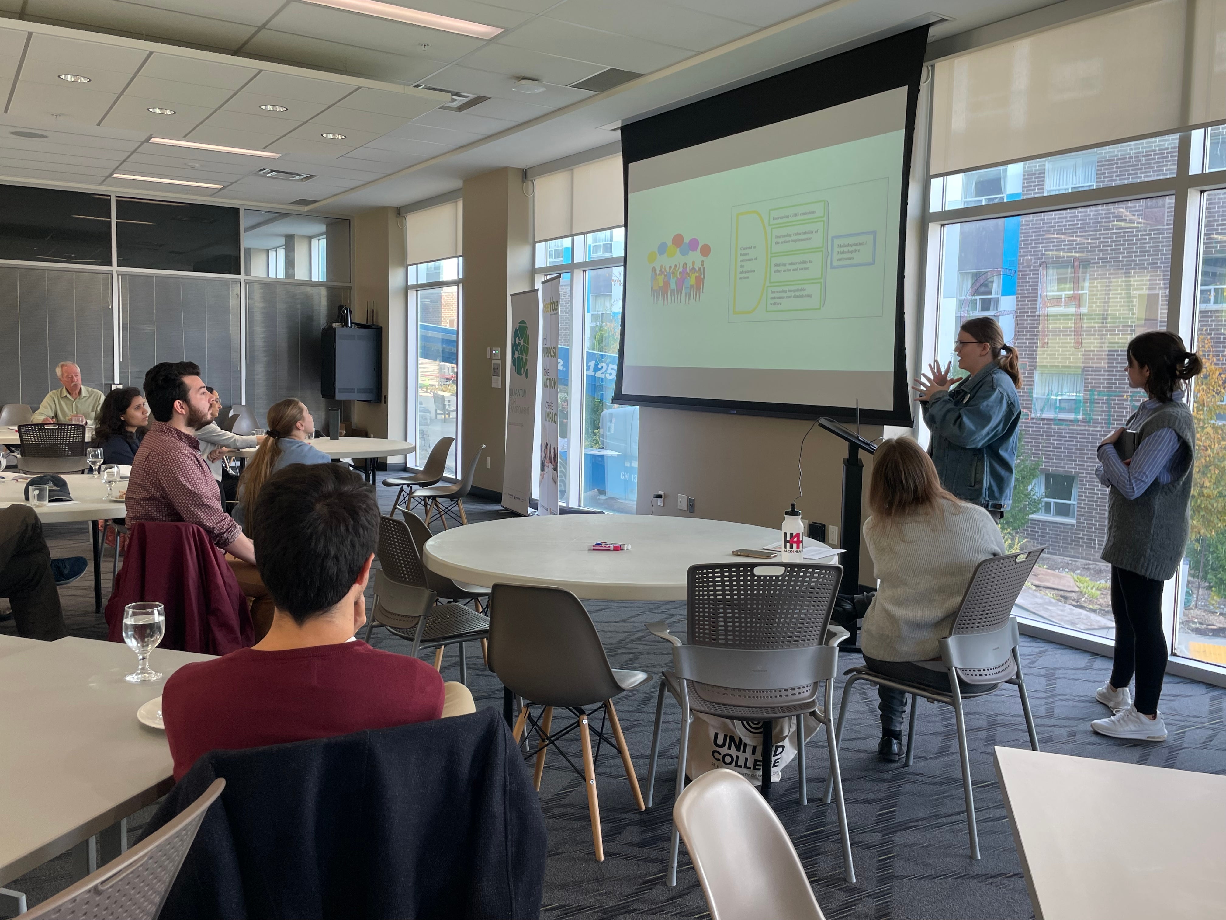 A person giving a presentation to a room of people. 