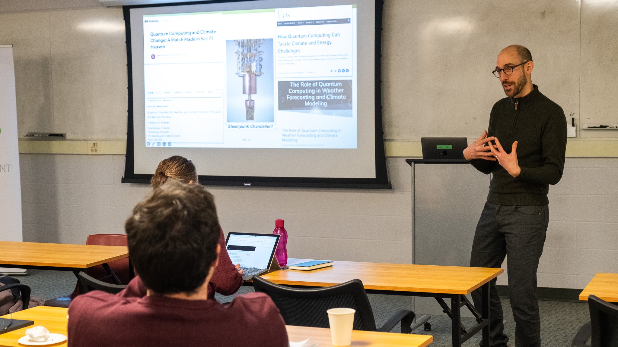 A person giving a presentation to a room full of people. 
