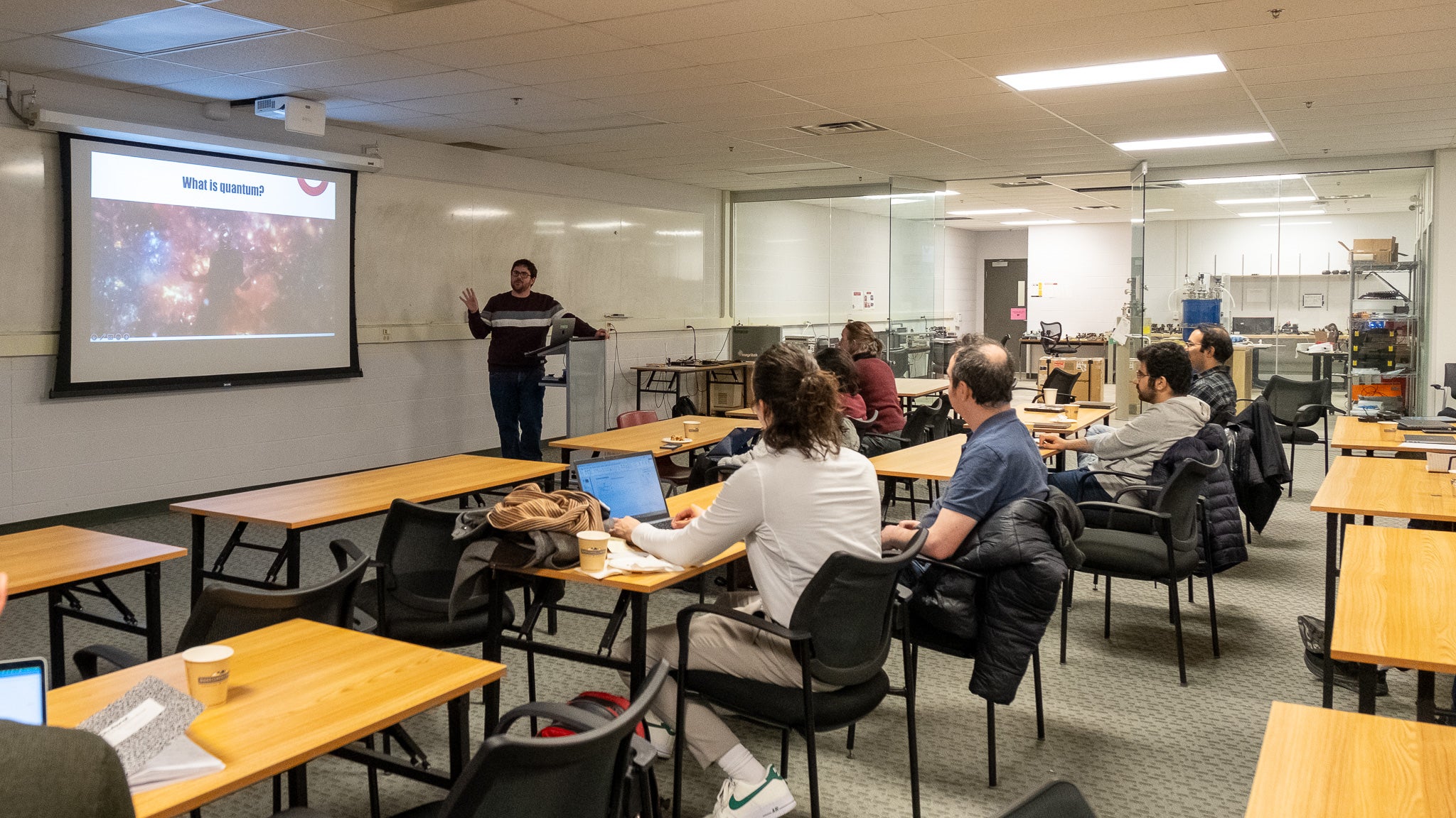 A person giving a presentation to a room full of people. 